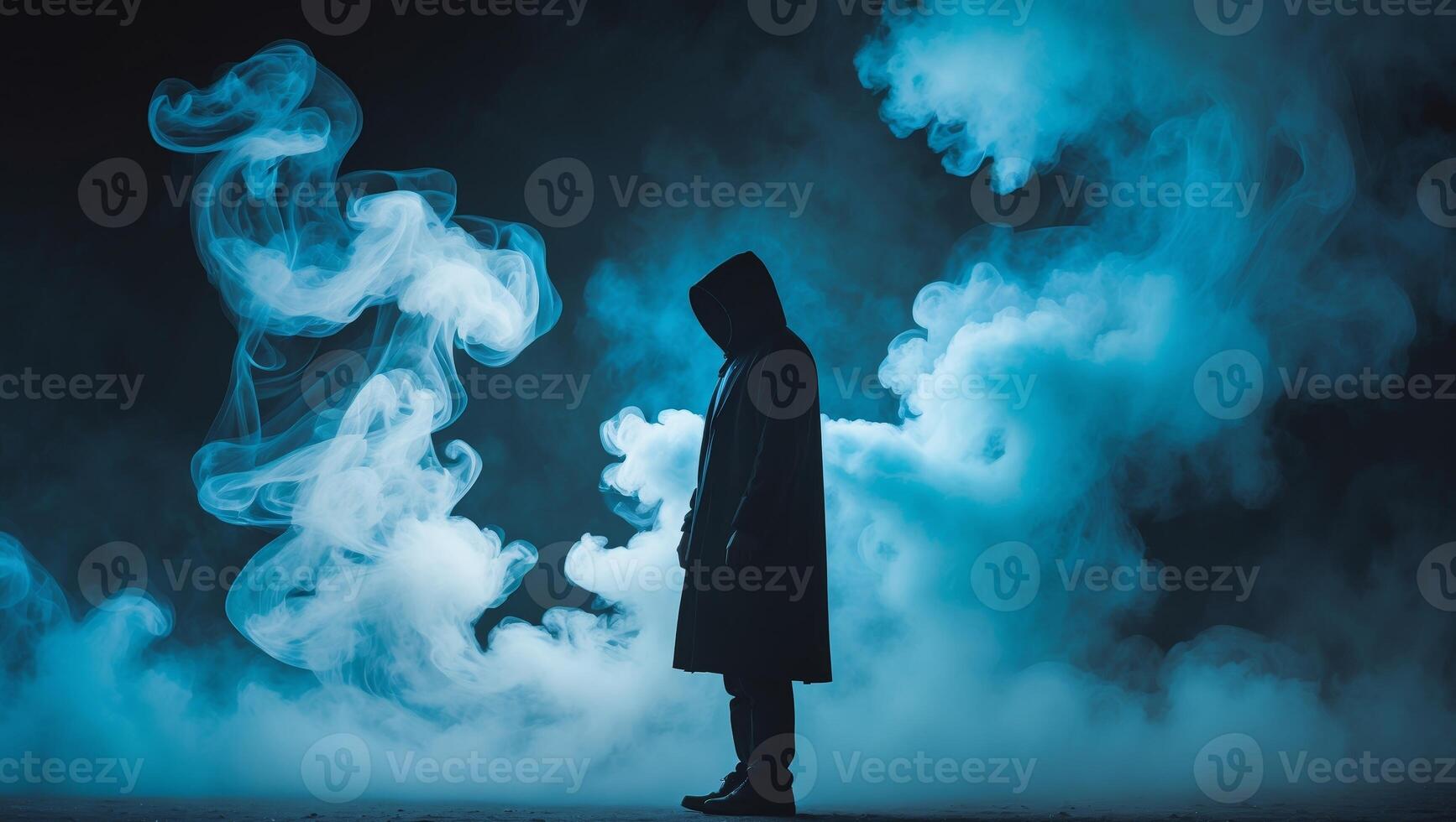 Silhouette of Hooded Figure in Blue and White Smoke at Night photo