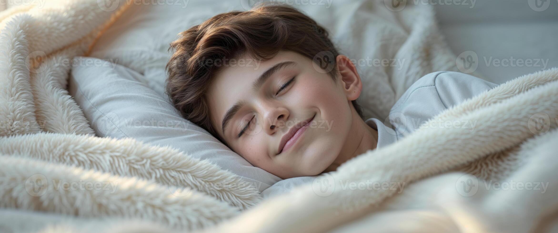 Teenage boy enjoying a peaceful sleep under a cozy blanket photo