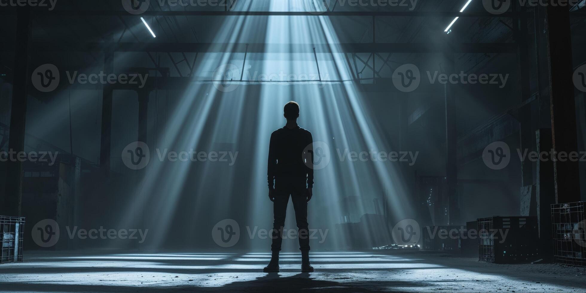 Silhouette of Person in Warehouse with Dramatic Lighting Effects photo