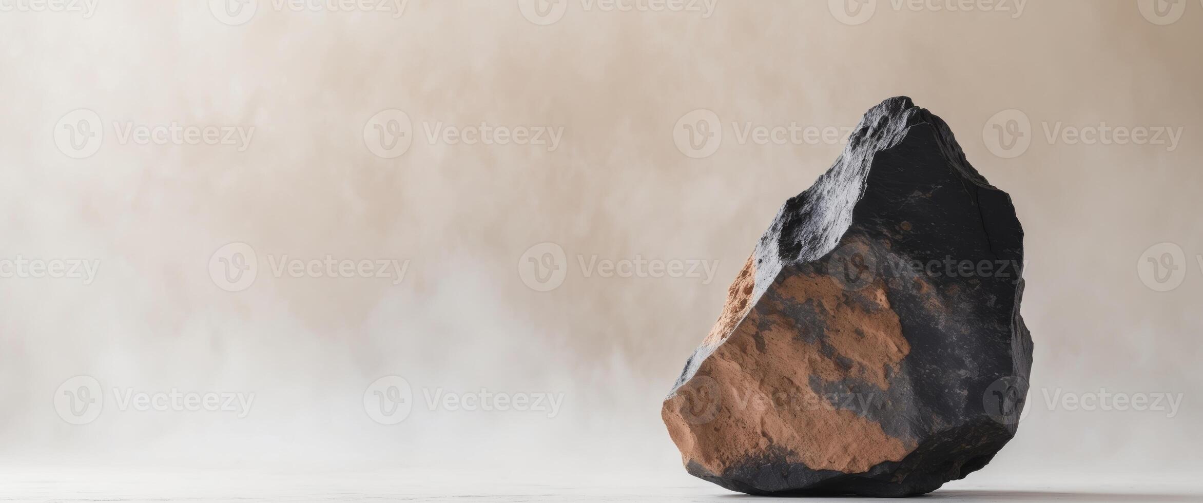 Natural rock with black and brown coloration. photo