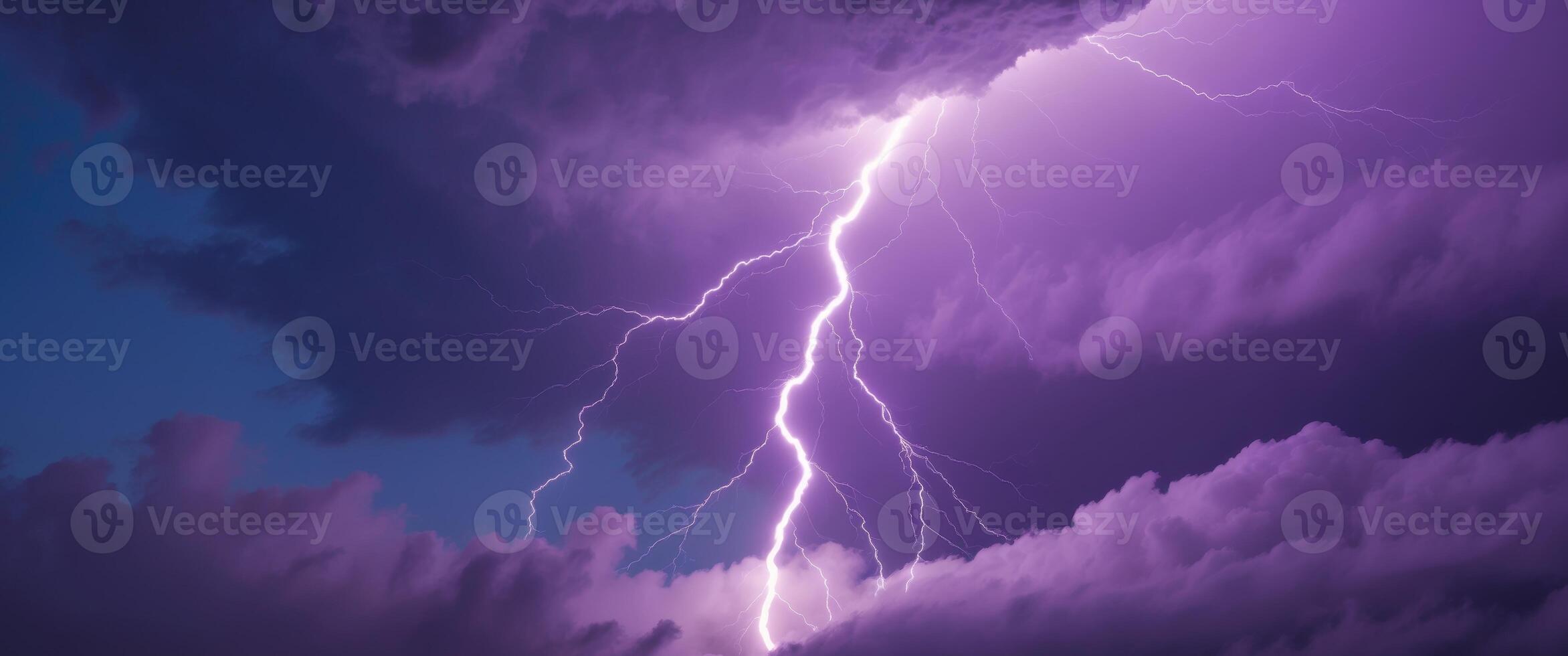 Lightning bolt striking through the clouds photo
