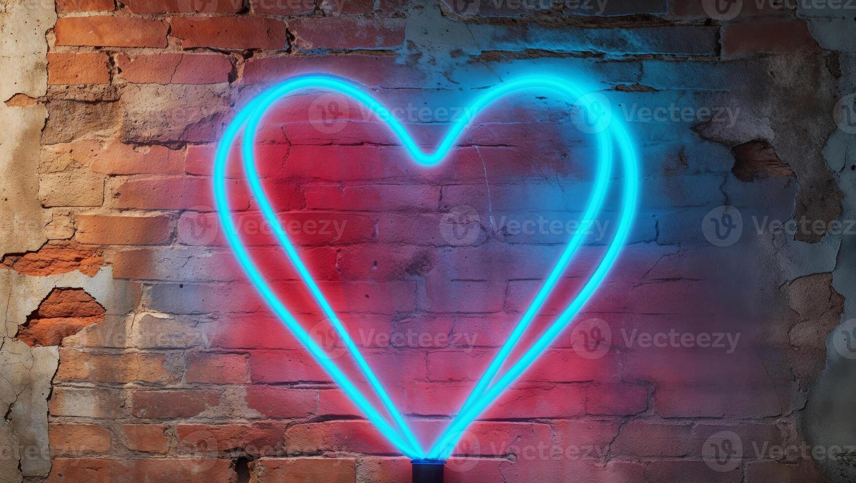 A blue neon heart with a red outline glows on a brick wall photo