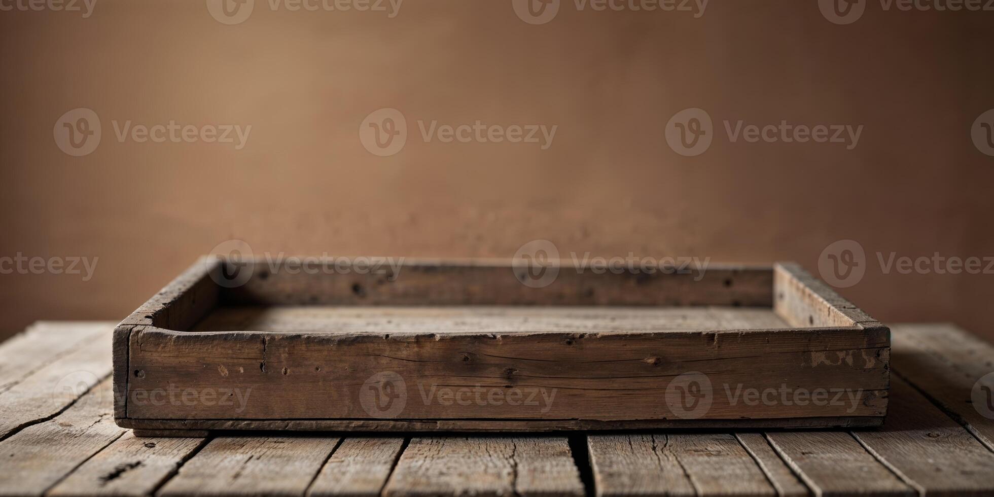 An empty wooden box sitting on top of a wooden table photo