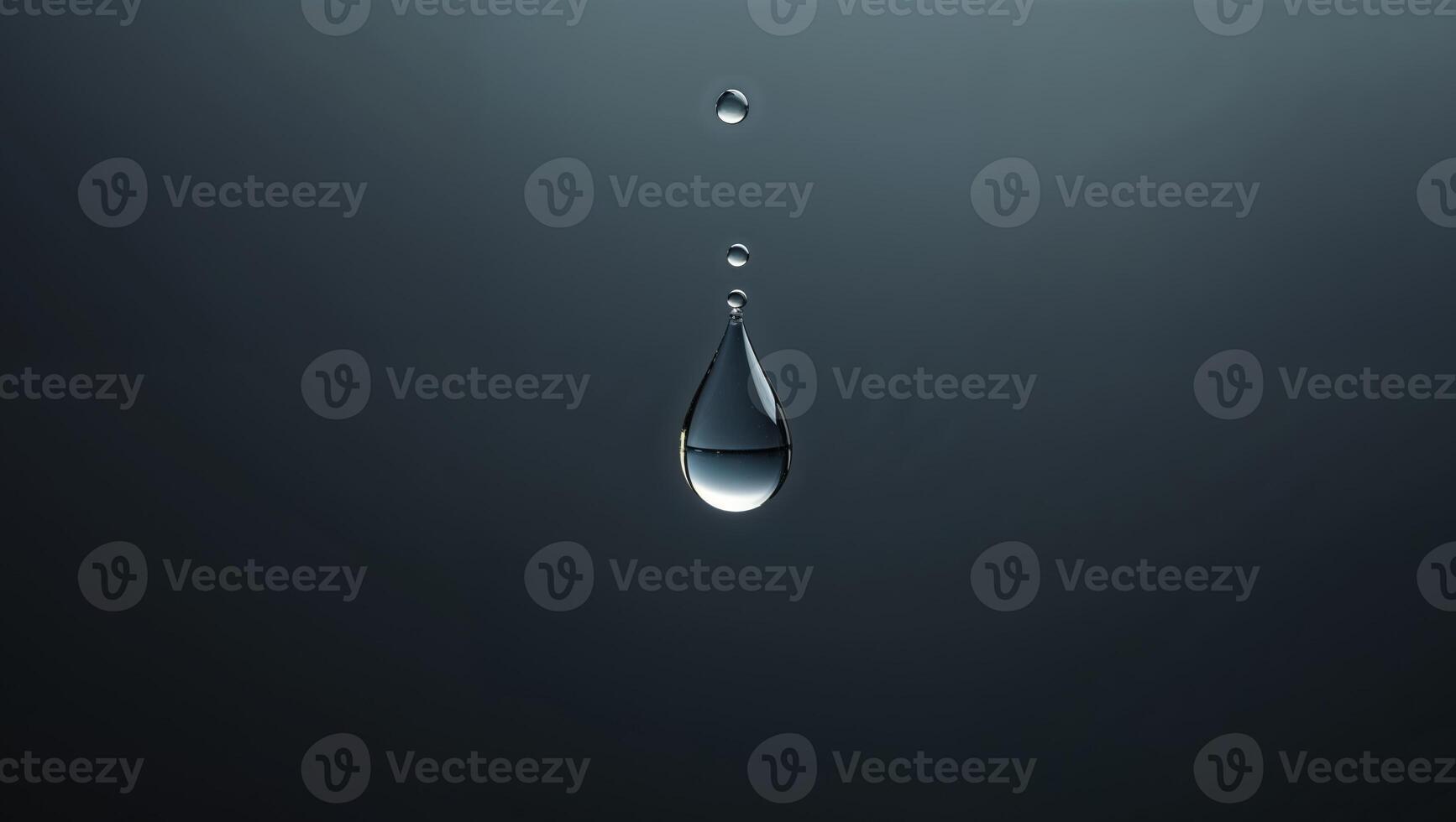 Falling drop of water in the form of a triangle on dark background photo