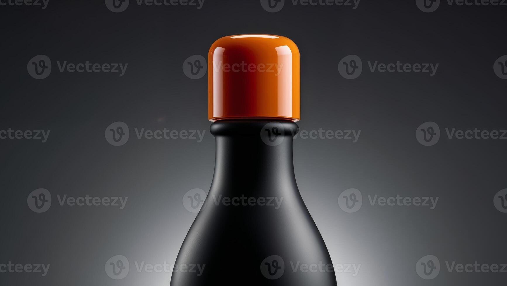 A black and orange wine bottle with a black cap photo