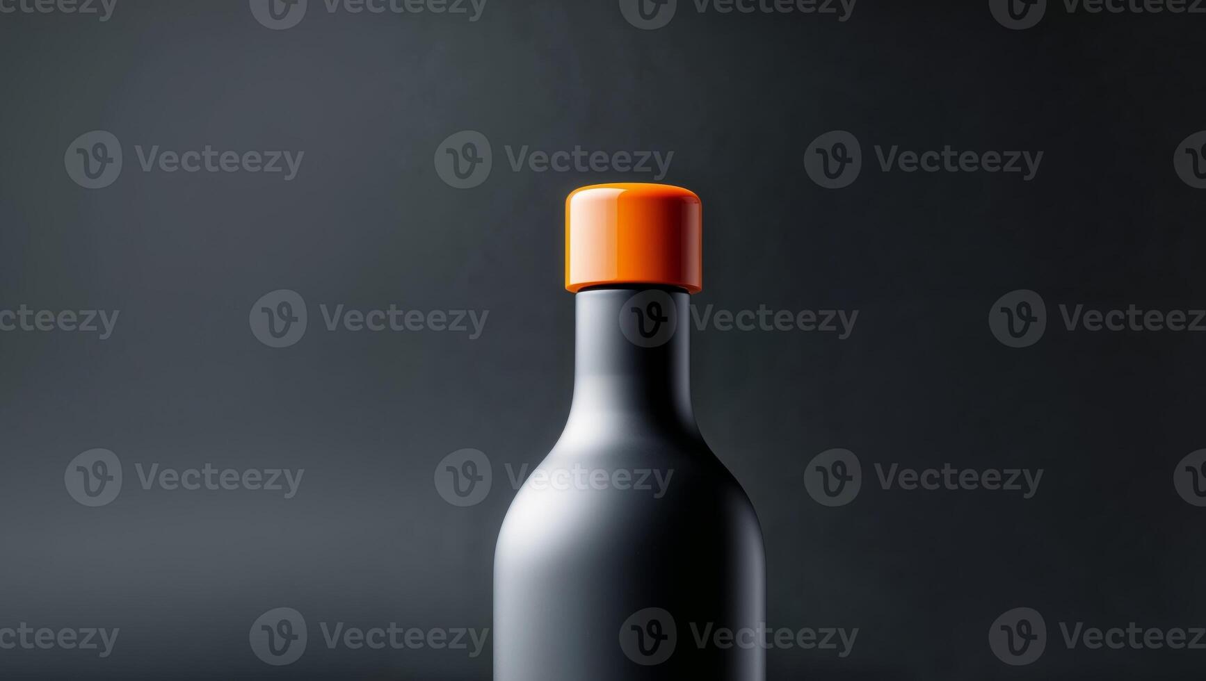 A black and orange wine bottle on a black background photo