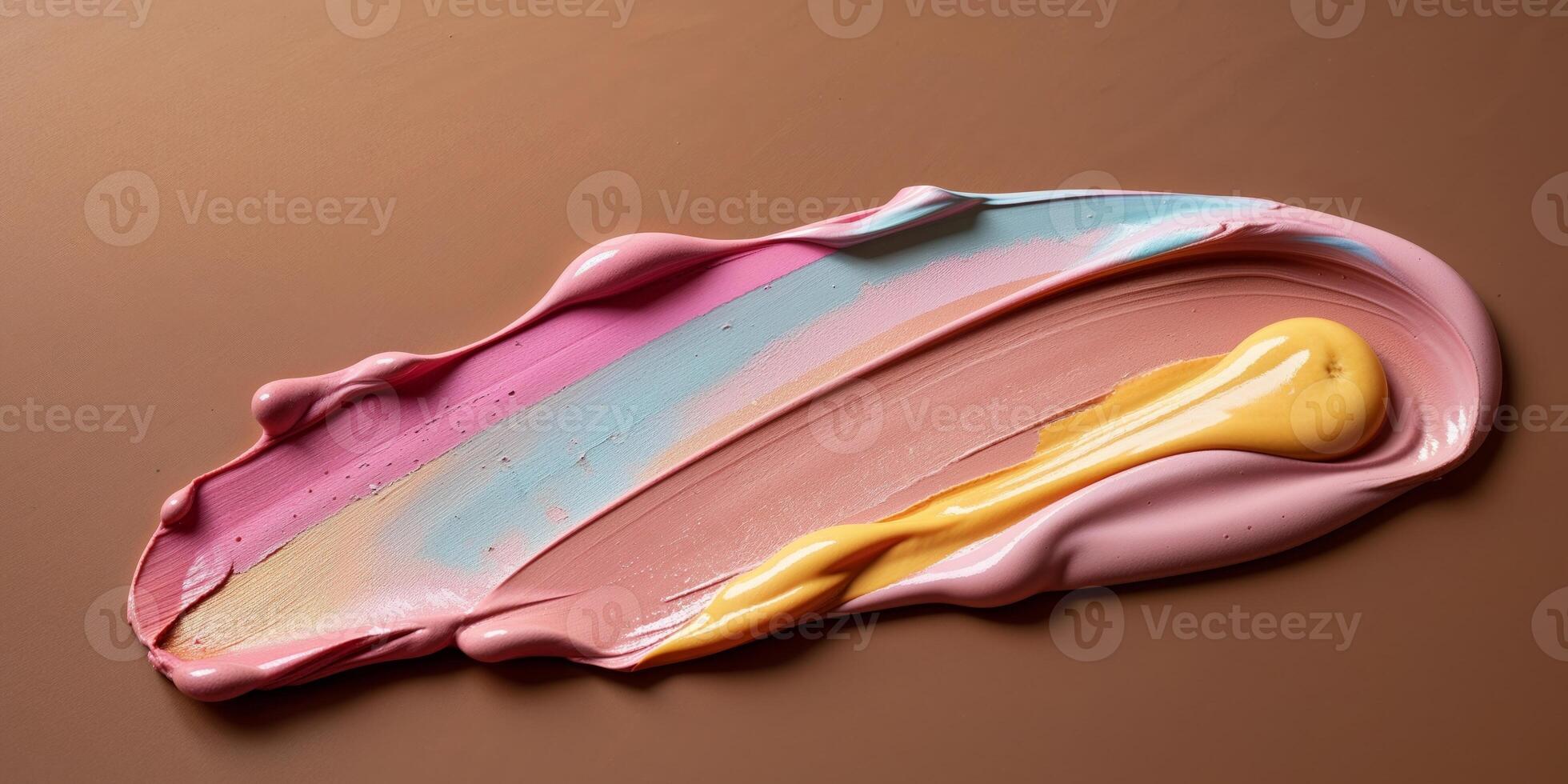 A smear of cosmetics with various color tones on a brown background. photo