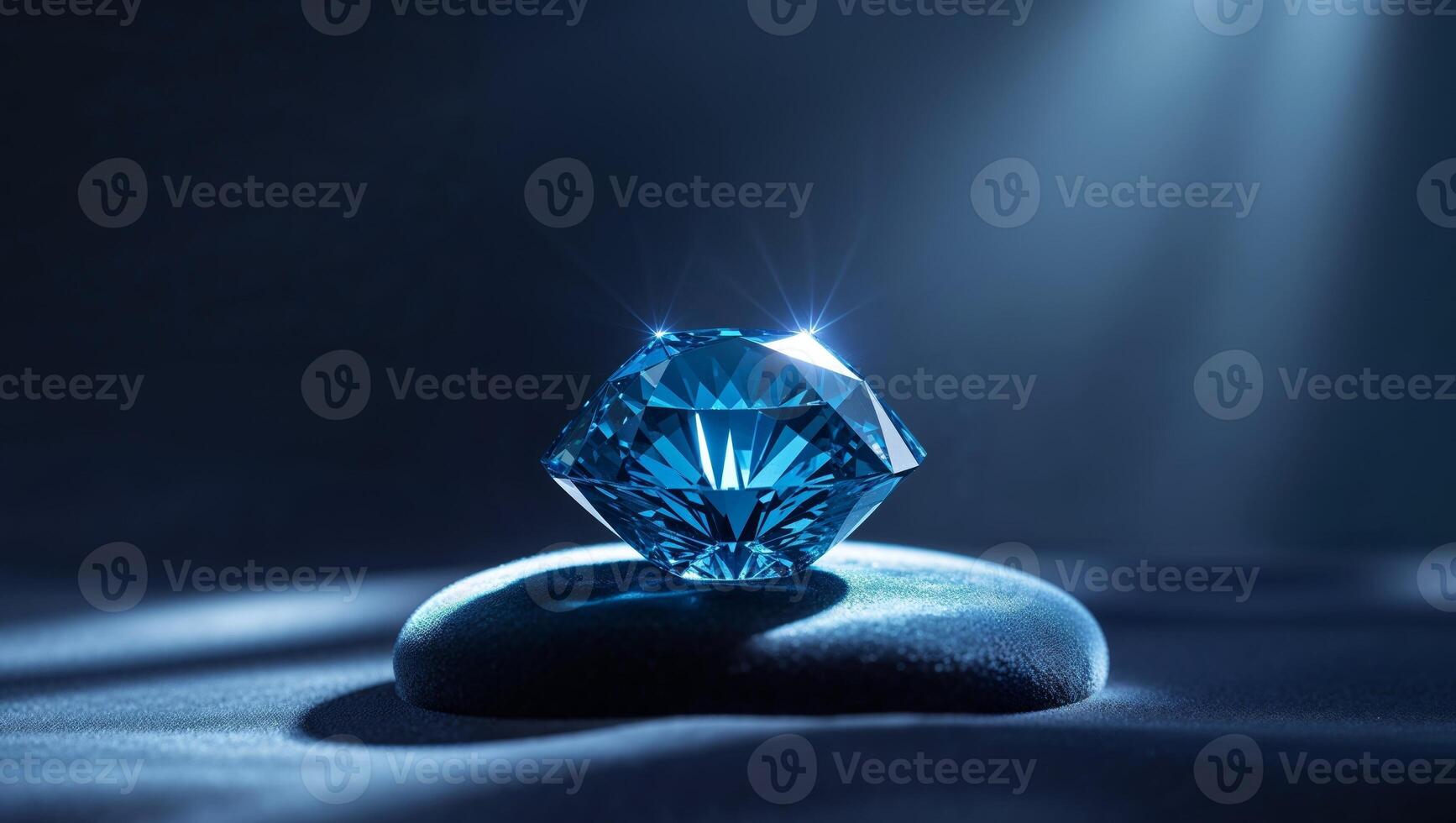 A blue diamond sitting on top of a rock photo