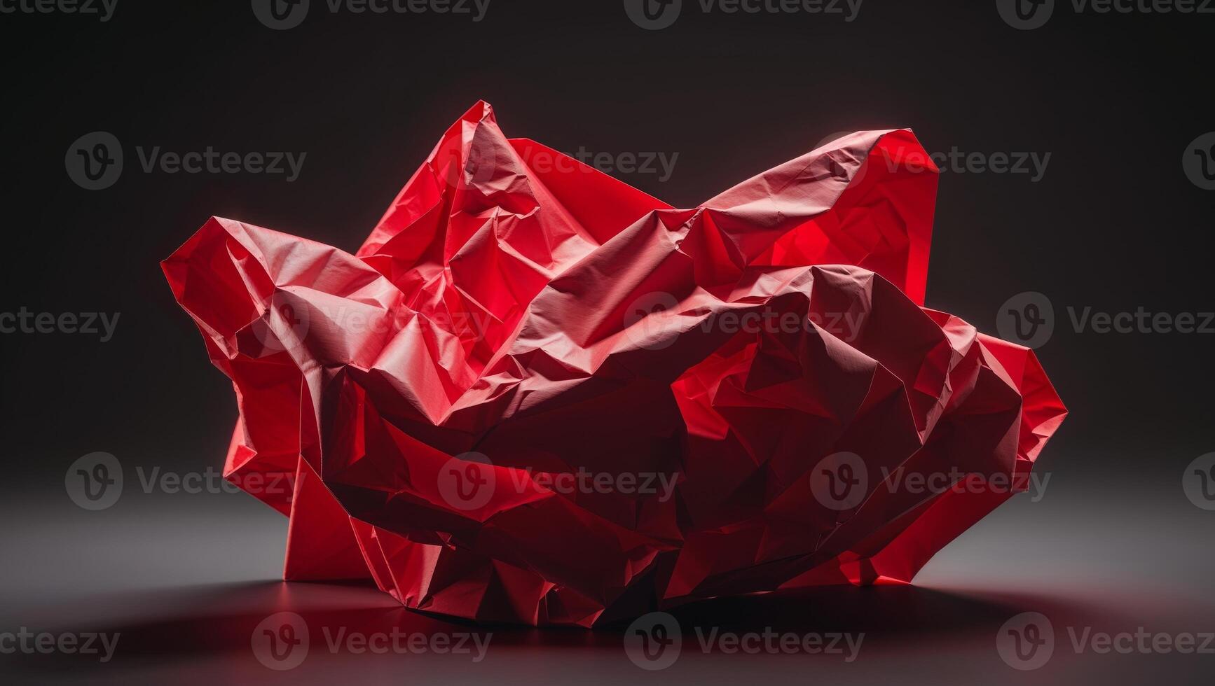 Abstract Red Crumpled Paper on Dark Background. photo
