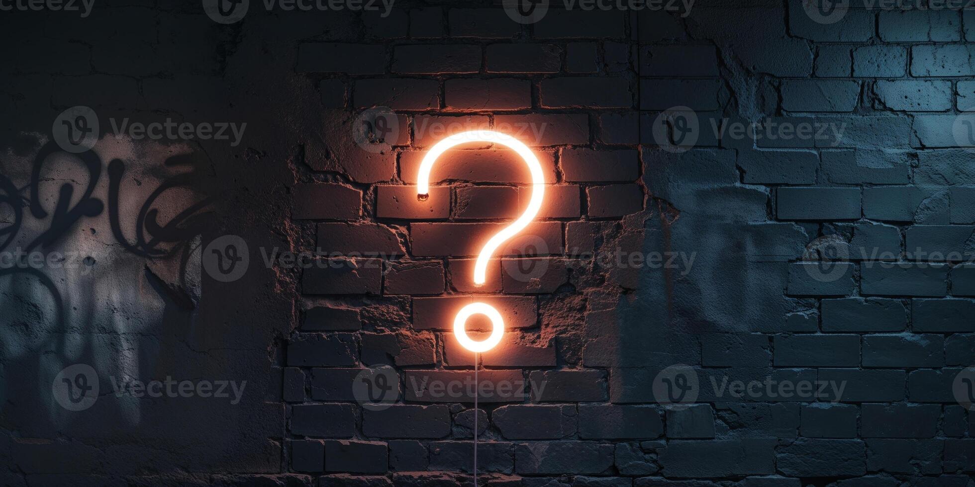 A neon sign with a question mark on a brick wall photo