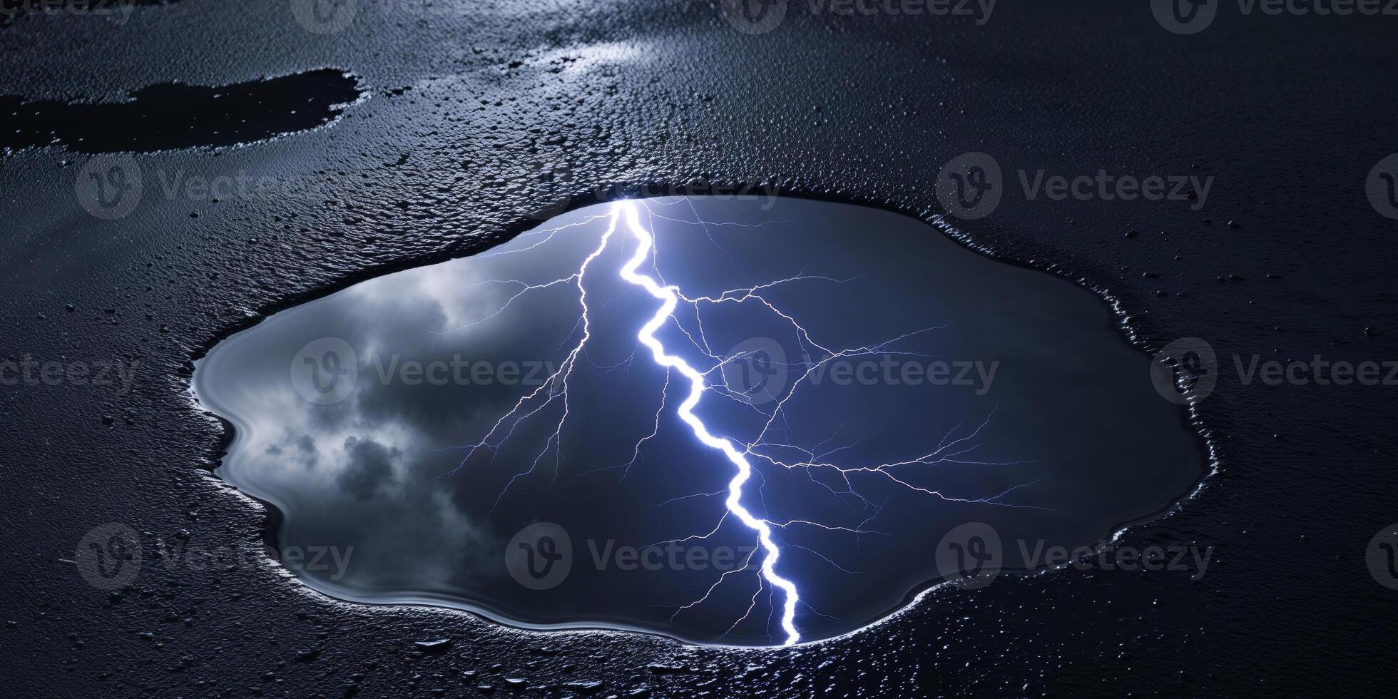 Dramatic Lightning Reflection in Puddle on Dark Asphalt Surface. photo