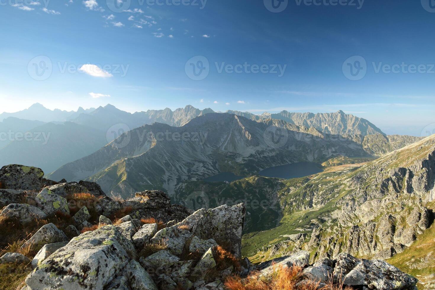 View of the high peaks in the Carpathian Mountains above the valley photo