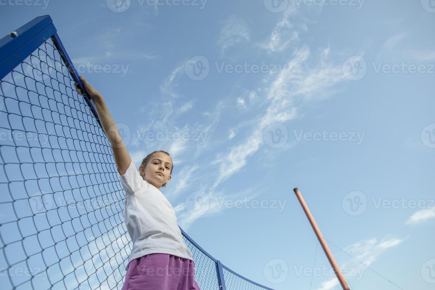 Elevating Dreams. Courageous Girl Reaches for Her Goals Amidst the Endless Skyline photo