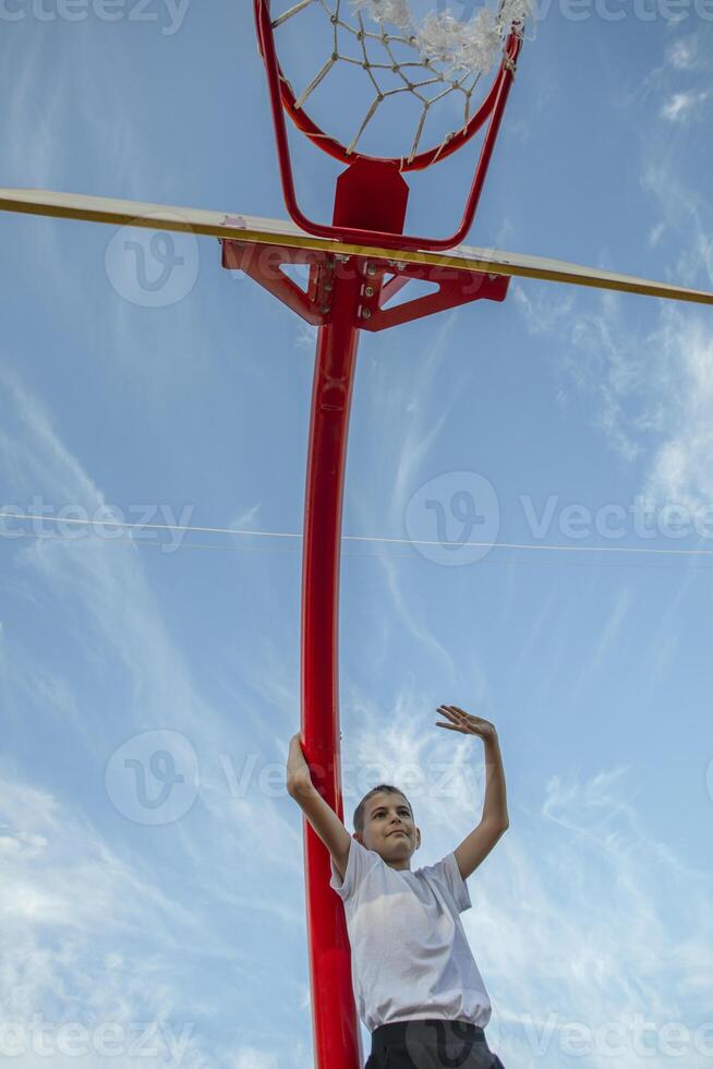 Courage in the Heights. Boy's Grit and Passion Shine Against the Vast Sky photo