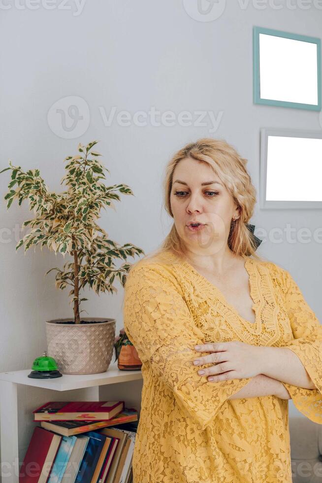 concerned mother standing in a home study area, expressing worry or contemplation, concept of parenting and home education photo