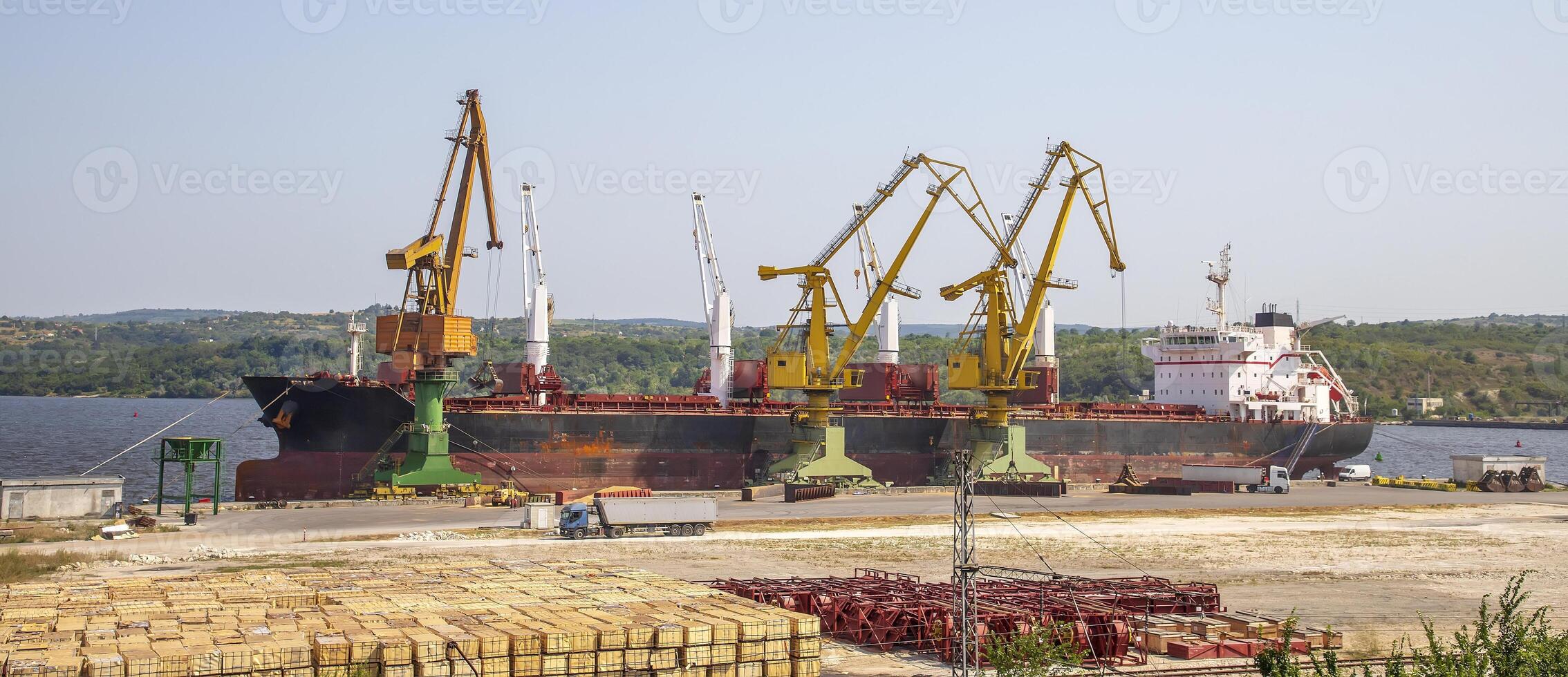 Panoramic view of a large ship loading grain for export. Water transport photo