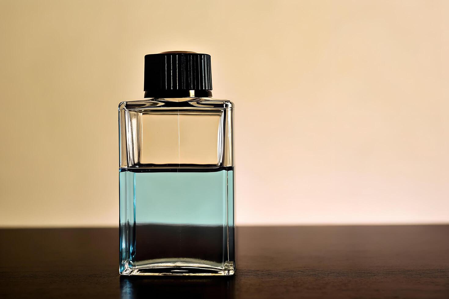 A small bottle of perfume sitting on a table photo