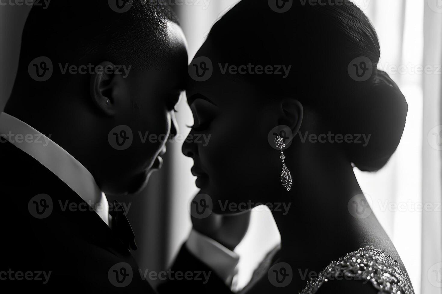 A black and white photo of a bride and groom