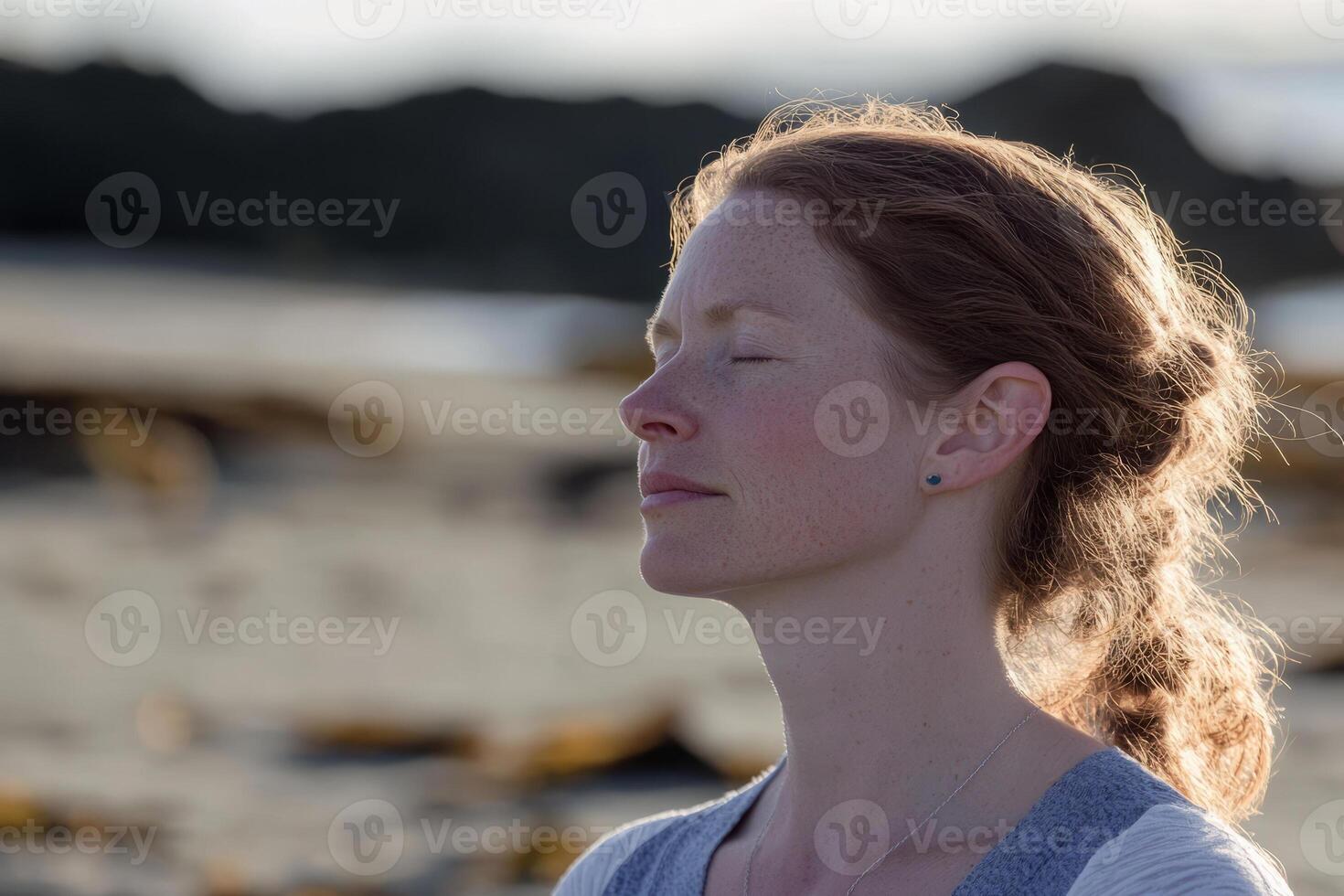 A woman with her eyes closed in meditation photo