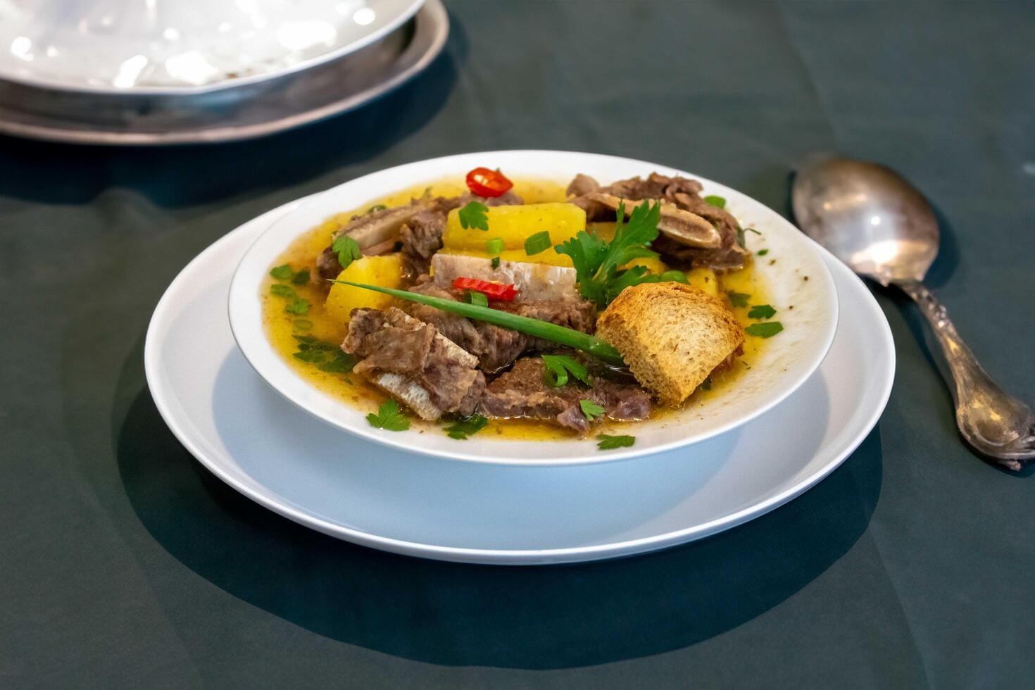 Traditional rustic Brazilian soup known as vaca atolada, prepared with cassava and beef ribs bb photo