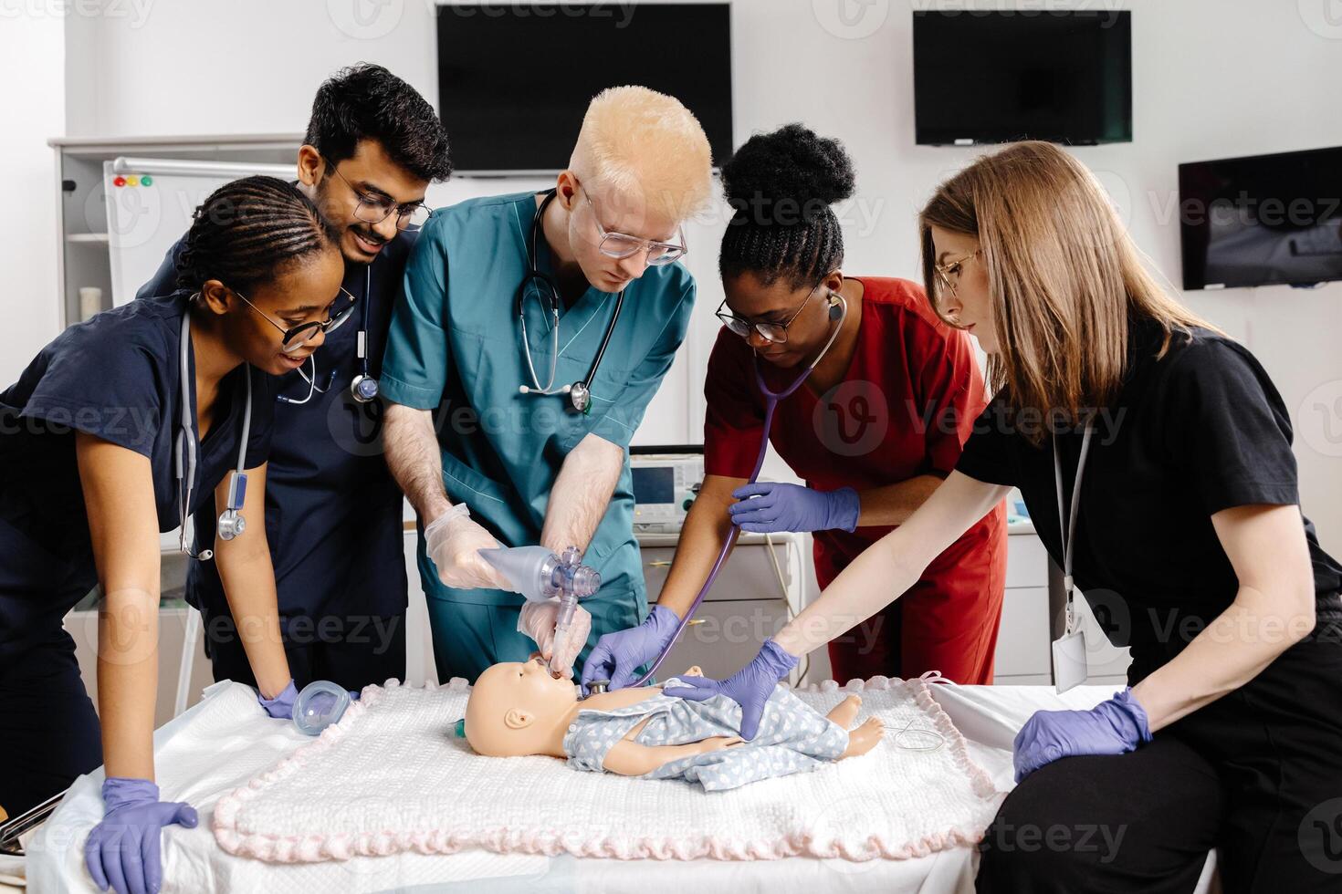 Medical Students Practicing Intubation Technique on Baby Mannequin during Training photo