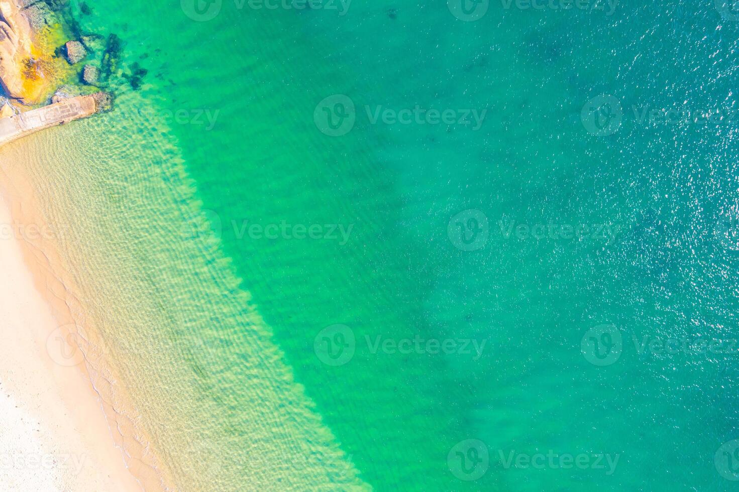 aerial beach serenity sand meets turquoise water pastel beach scene soft hues of sand and ocean, aerial drone top down view photo