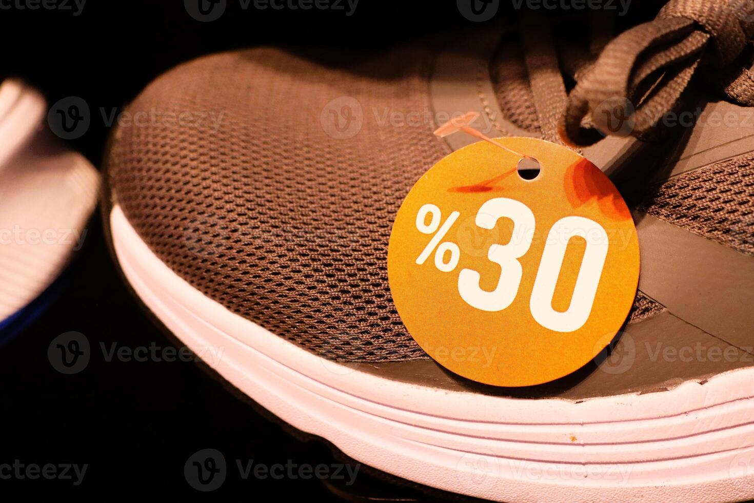 Sport Shoes Available at a Discounted Price Featuring a Price Tag Displayed Prominently photo