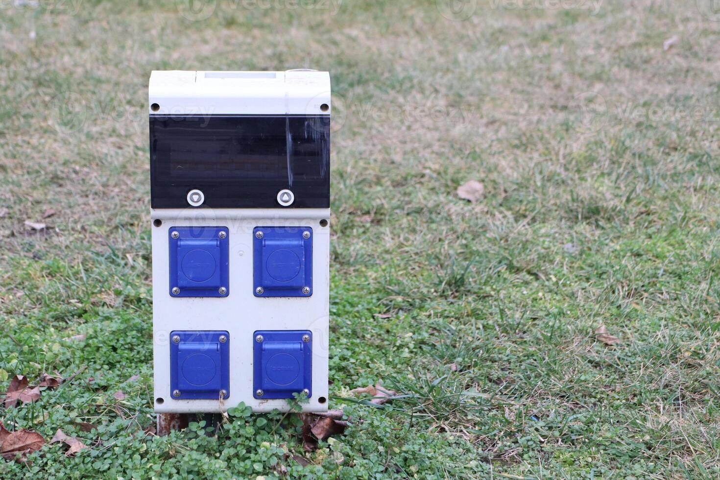 Utility Box Located in a Green Space Designated for Various Outdoor Purposes and Connectivity photo