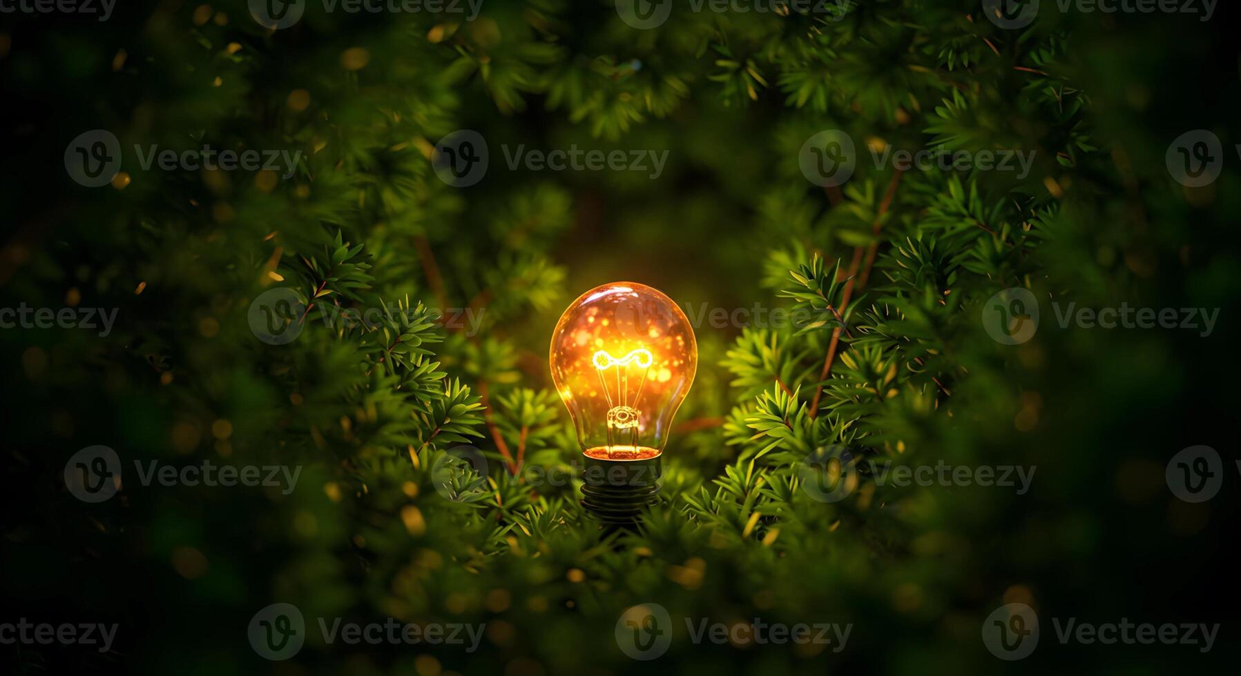 a light bulb is shining through the leaves of a tree photo