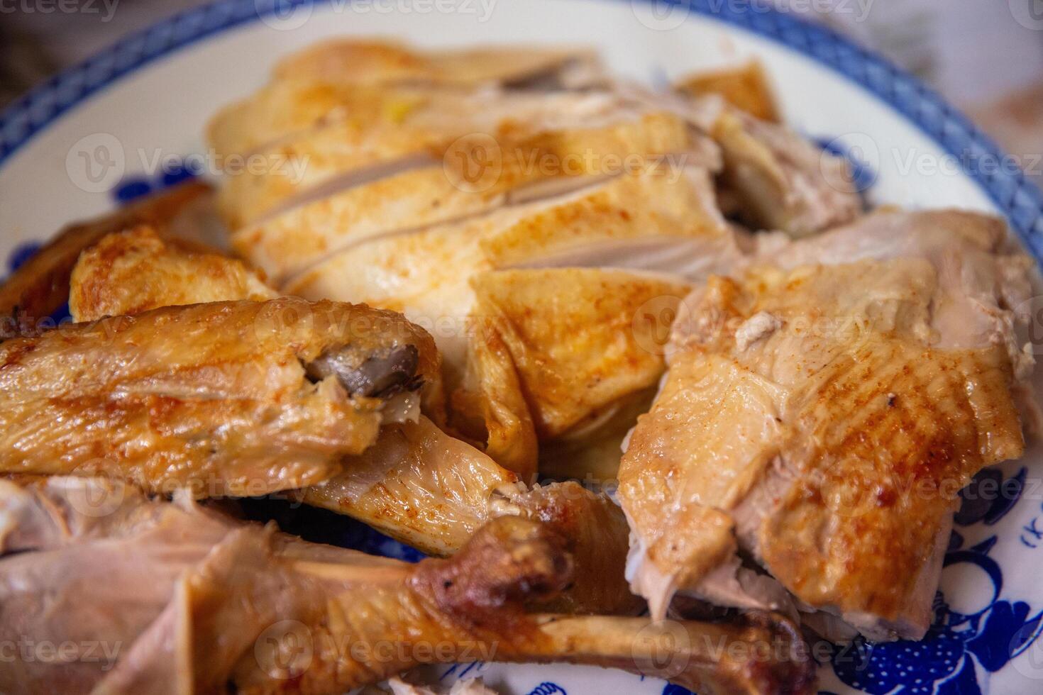 A plate of chicken on a table photo