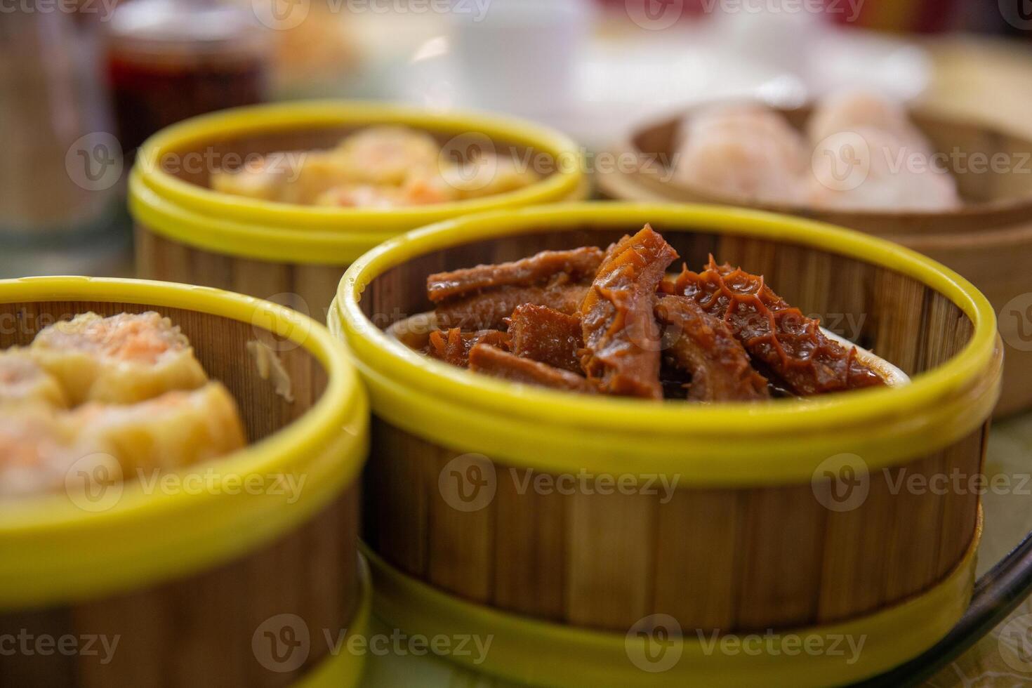 Three small containers with food in them photo