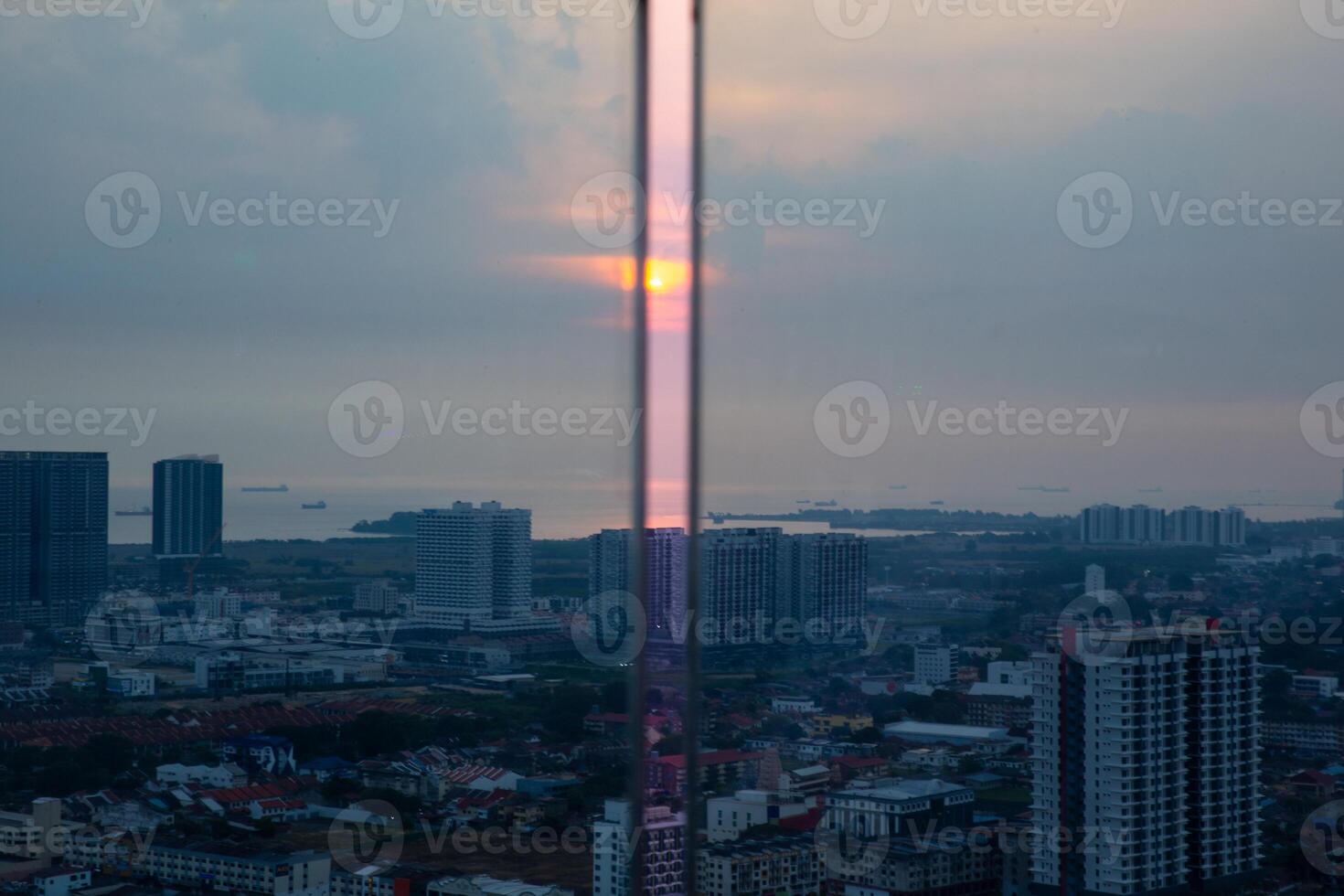 A tall building with a tall pole in the middle photo
