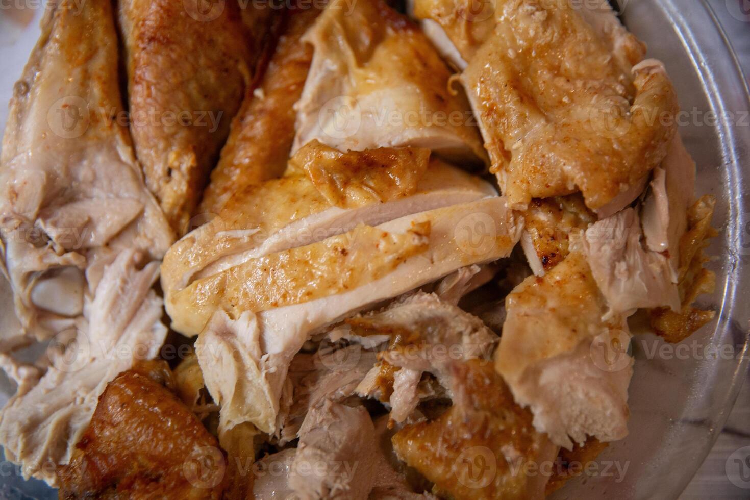 A close up of a chicken in a plastic container photo
