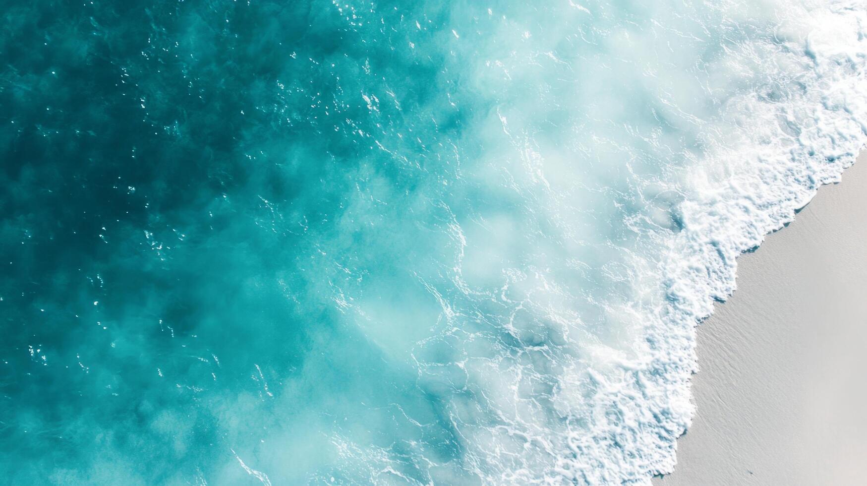 An aerial view of the ocean and waves photo