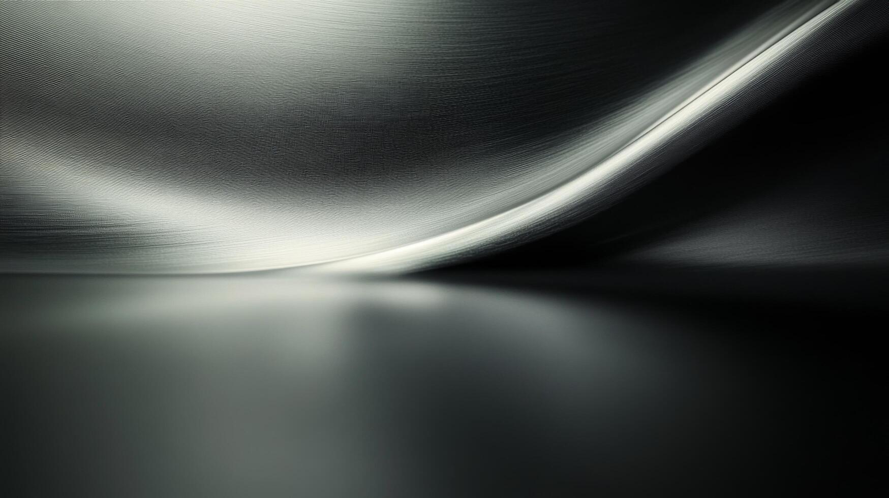 A black and white image of a shiny metal surface photo