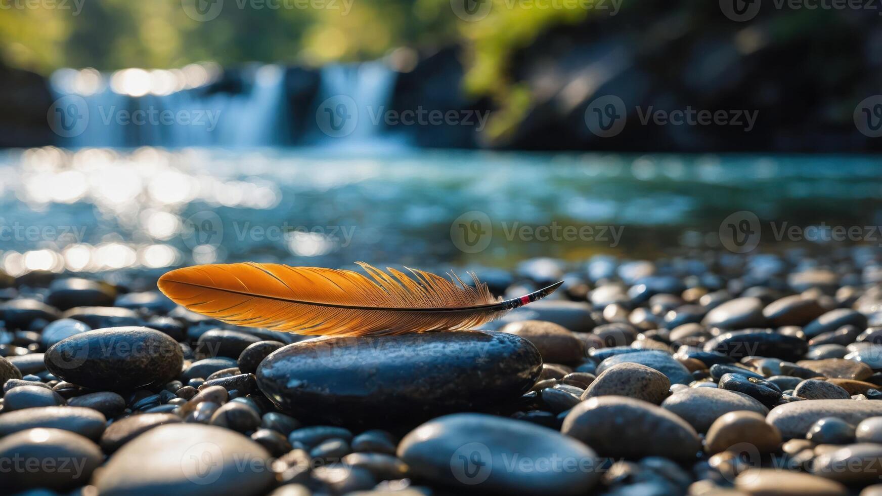 A feather rests on smooth pebbles near a serene waterfall, capturing nature's tranquility. photo