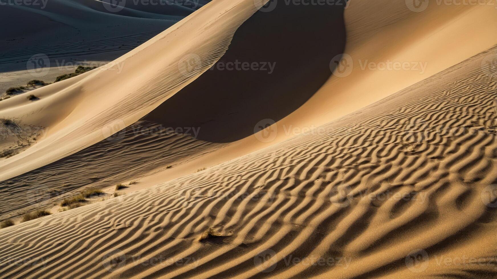 Sand dunes create a serene landscape with intricate patterns and shadows. photo