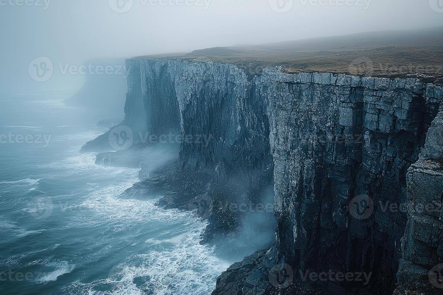 Misty Cliffs Meet Turbulent Ocean Waves photo