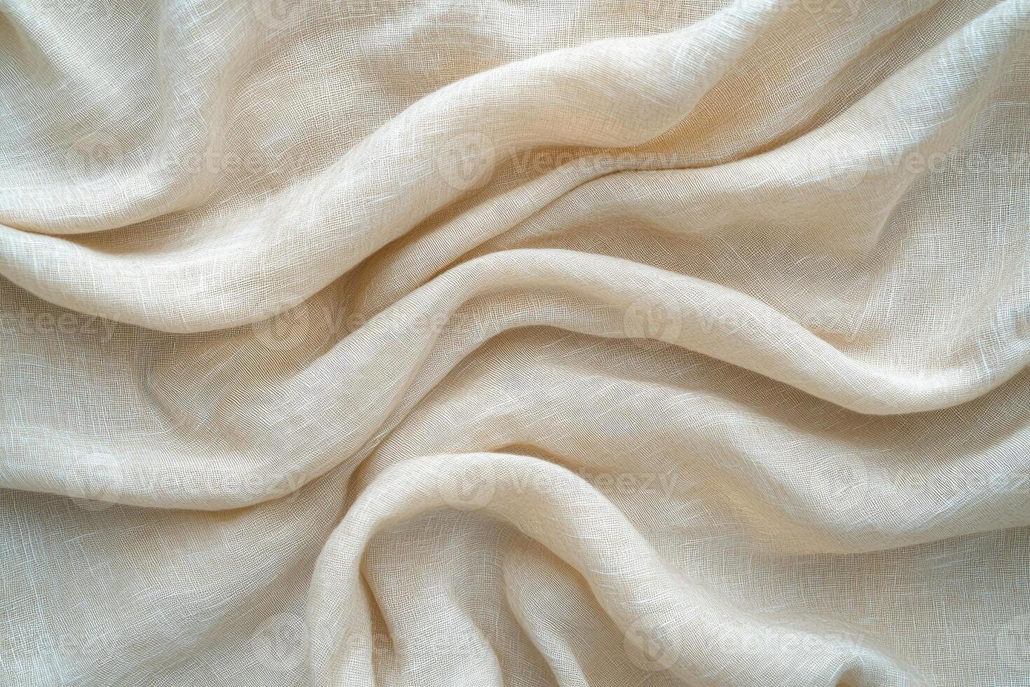 Draped beige linen fabric showing texture and folds photo