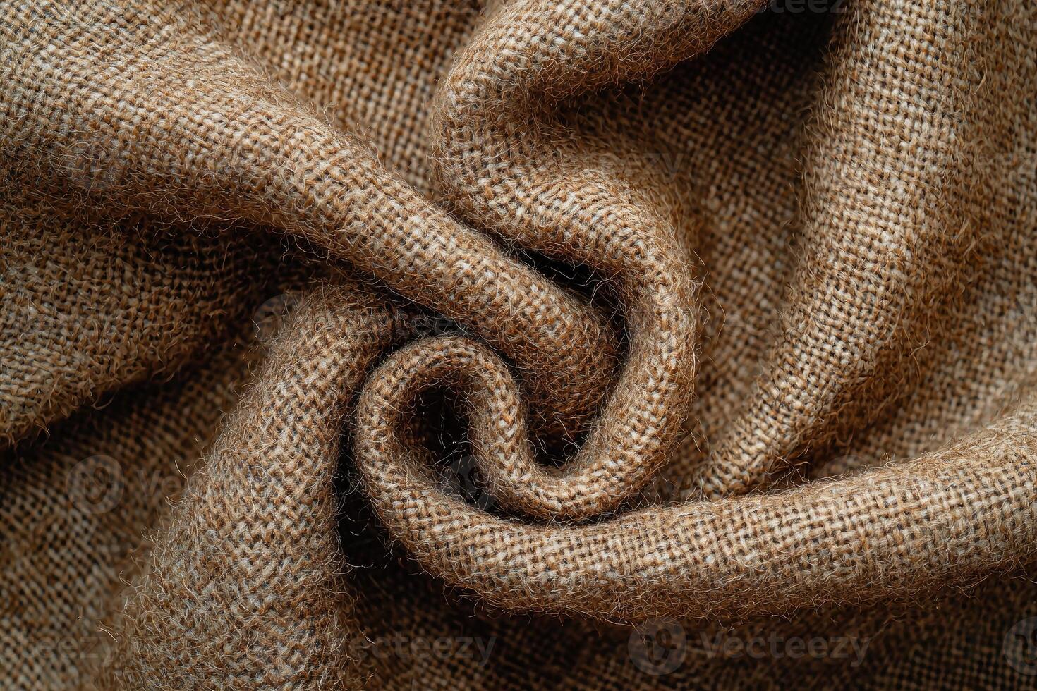 Brown burlap fabric swirls in a textured pattern photo