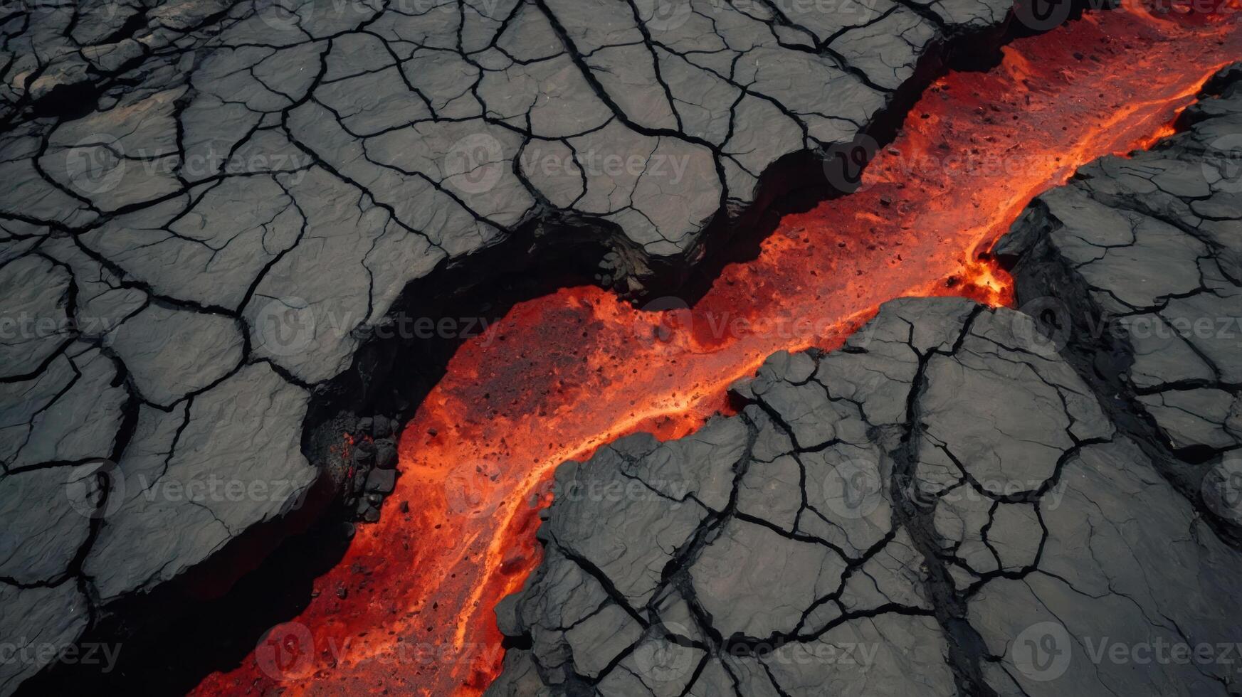 A close-up view of flowing lava in a cracked volcanic landscape. photo