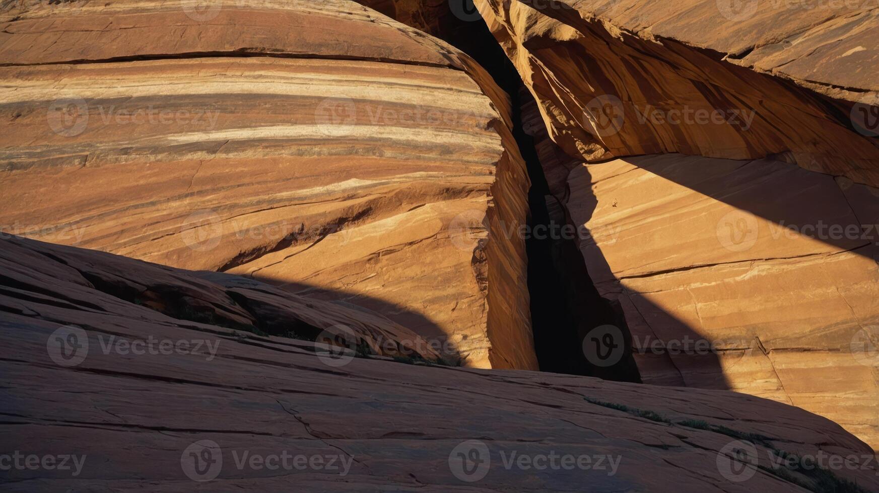 A close-up view of layered rock formations in a canyon, highlighting natural textures and shadows. photo