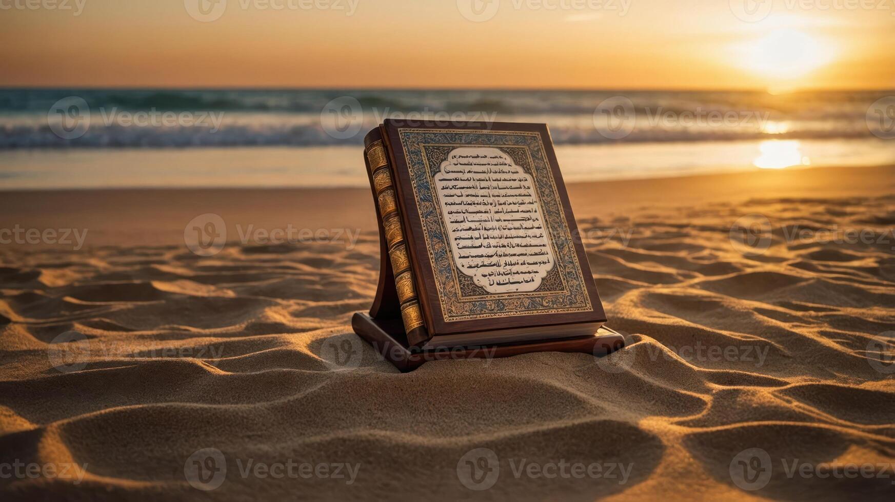 A Quran rests on the sandy beach at sunset, symbolizing peace and reflection. photo
