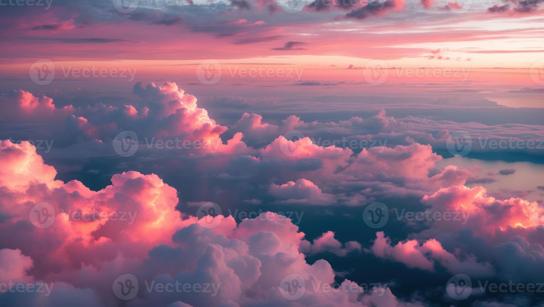 Aerial View of Clouds at Sunset with Pink and Purple Sky photo