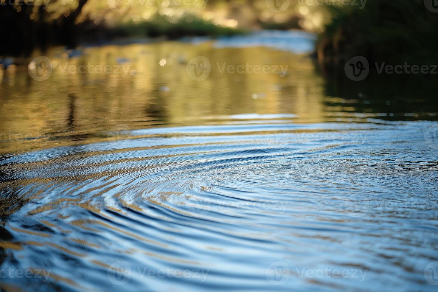 Water ripple expands on calm river surface, concentric ripple effect photo