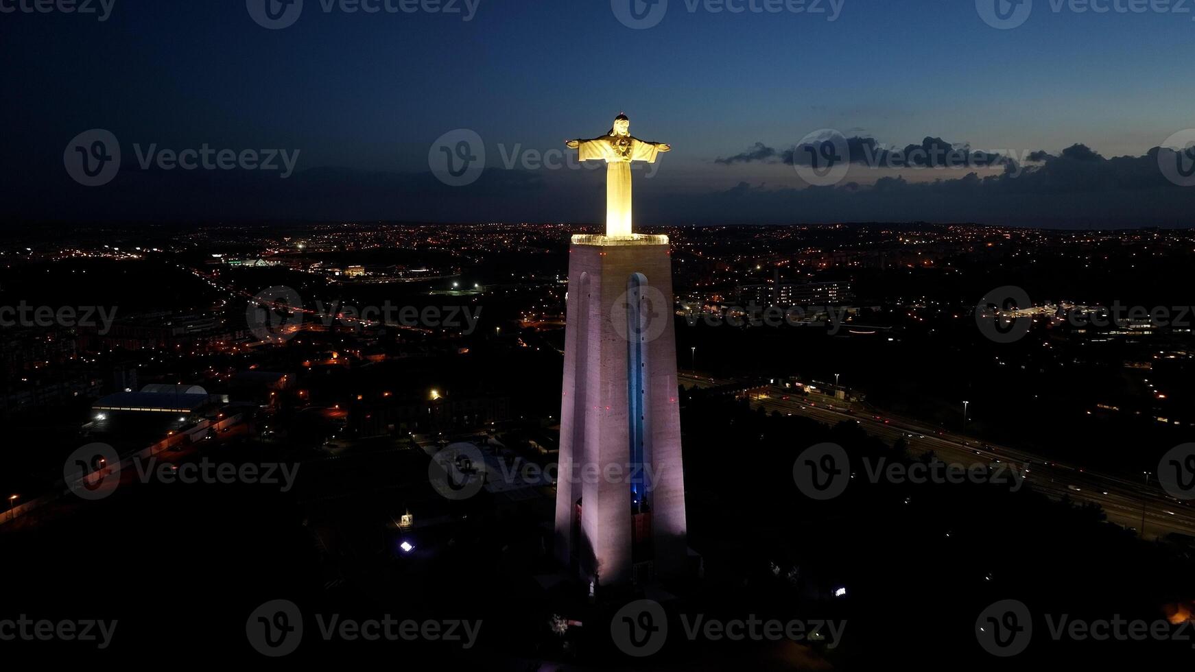 Stunning king christ in Almada District of Lisbon in Portugal. Lisbon 25Th April Bridge. photo