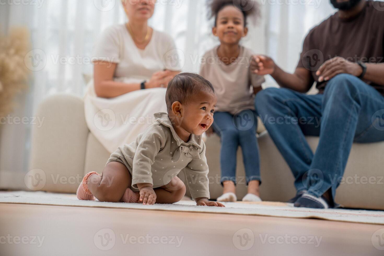 Family enjoys quality time together as baby crawls on soft carpet in cozy living room during afternoon playtime photo