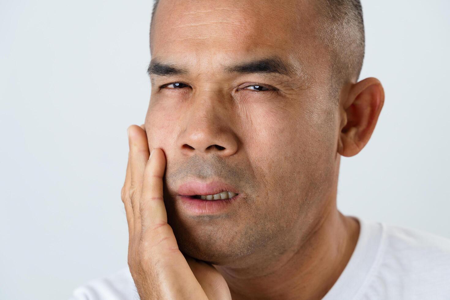 The man has facial swelling due to an allergic reaction to triggers such as insect bites stings.2 photo