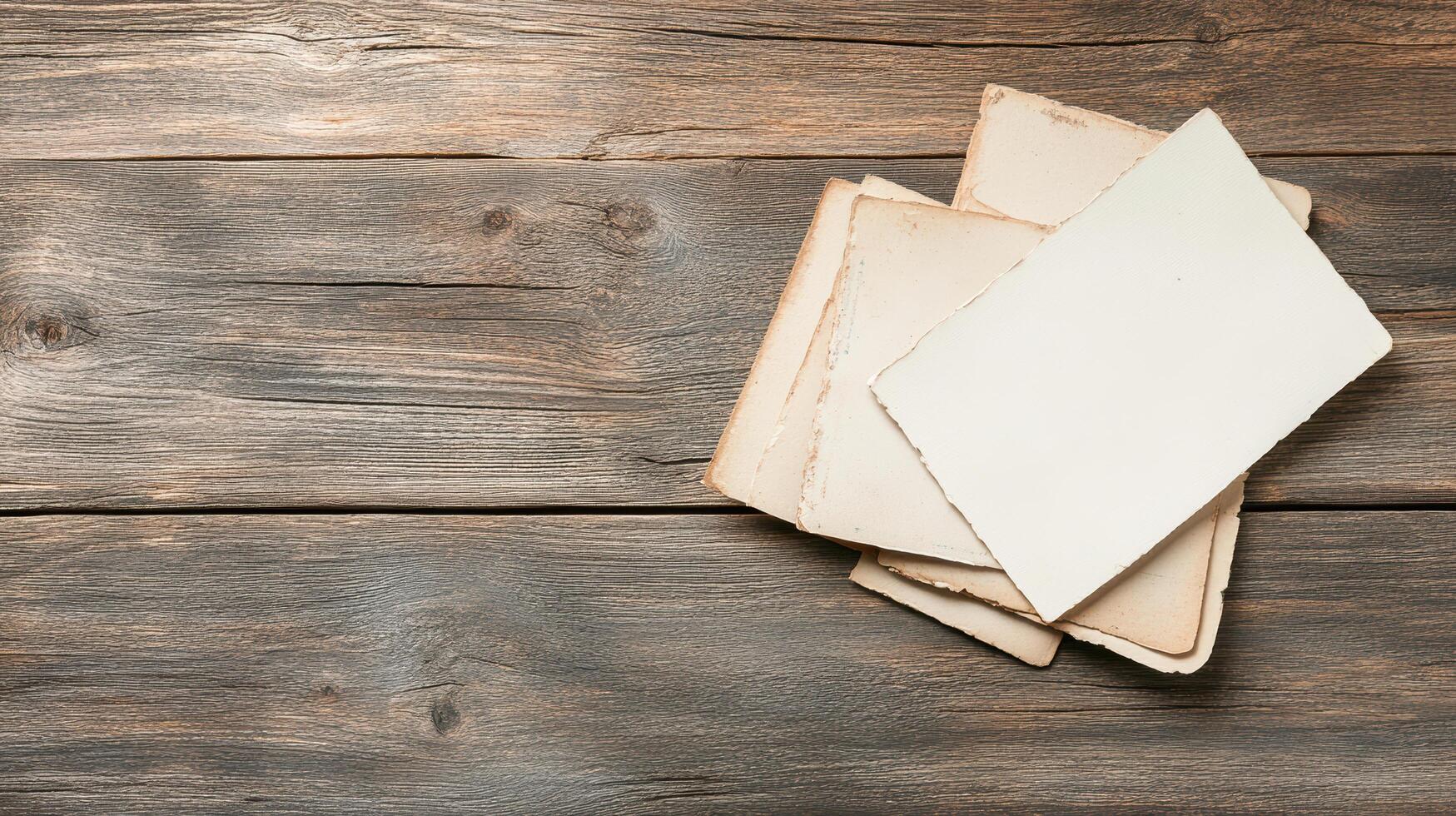 Old papers on a wooden table photo