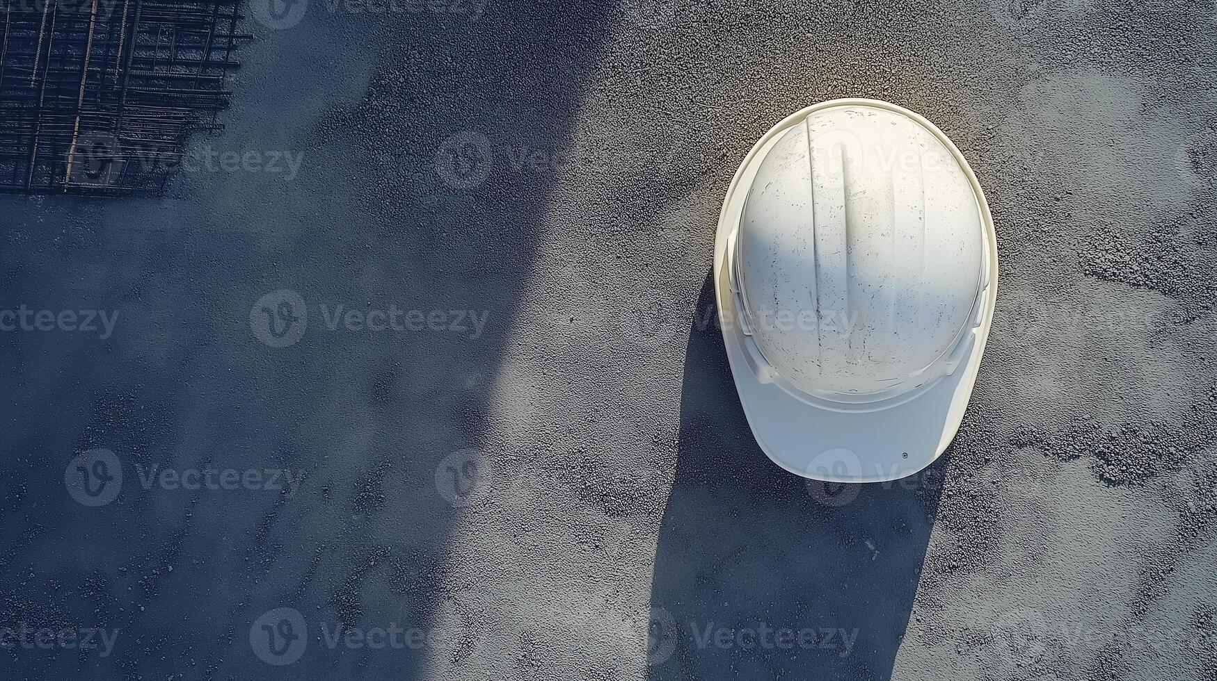 Labour Day. Top view of a construction helmet on a concrete surface photo